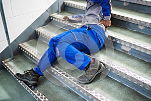 Worker Man Lying On Staircase photo