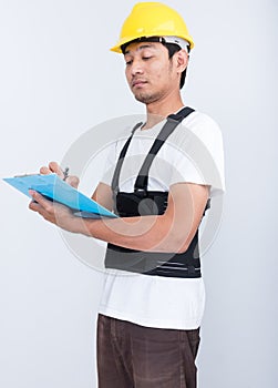 Worker man stand write book note wearing back support