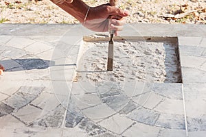 Worker man used chisel extract cement repair tile