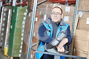 Worker man with warehouse barcode scanner