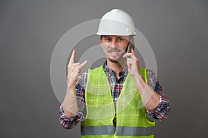 Worker man wearing protective hard hat and reflective vest