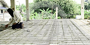 worker man working strong iron wire on precast concrete slabs prepare for reinforce structure floor. rebar make net for use