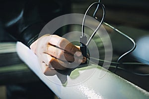 worker measures the thickness of the pipe. Checking the pipes at