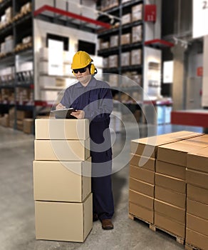 Worker in Mechanic Jumpsuit with holding parcel boxes