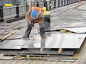 Worker with metal cutting torch