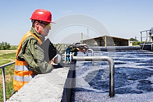 Worker monitor filtering industrial water