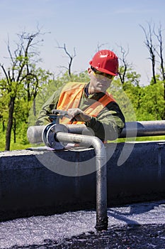 Worker monitor filtering industrial water