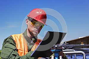 Worker monitors water filtration photo