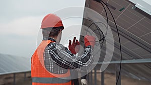 Worker mounting solar panels