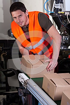 Worker next to production line