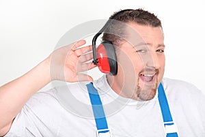 Worker with noise-cancelling headphones