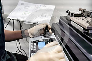 A worker operates a 3D optical measuring machine to ensure high quality and accuracy of manufactured products