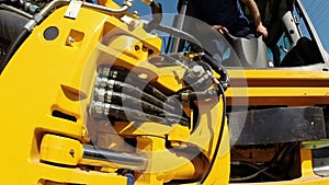 A Worker Operates Heavy Machinery