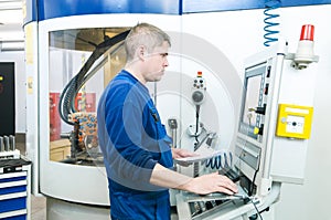 Worker operating CNC machine center