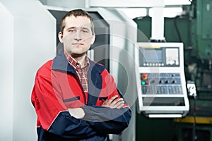 Worker operating CNC machine center