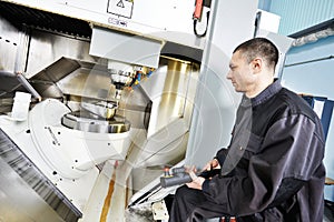 Worker operating metal machining center