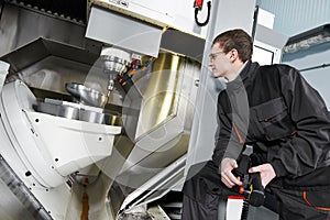 Worker operating metal machining center