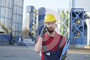Worker outside a factory working