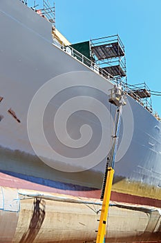 Worker painting of the ship