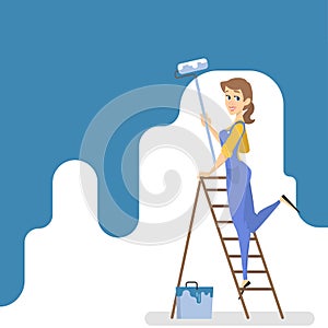 Worker painting the wall with blue paint