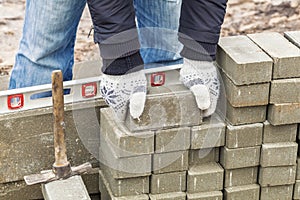 Worker with paving bricks