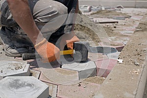 Worker paving stones