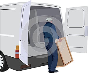 Worker person loads the van with furniture- photo