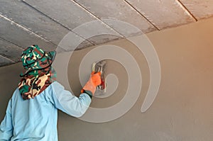 Worker plastering tool plaster concrete on interior wall
