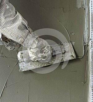 Worker plastering tool plaster marble