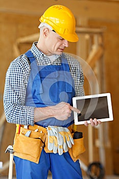 Worker pointing at tablet