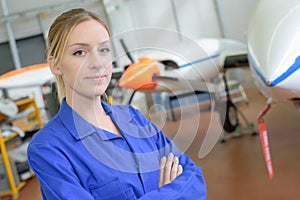 worker posing in hangar
