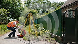 Worker prepare geodetic device for surveying