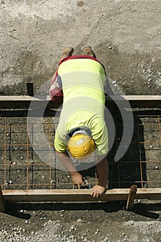 Worker preparing for a footpath sidewalk