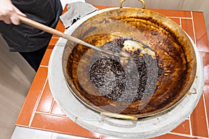 Worker preparing tapioca pearl balls into bubble or boba tea