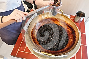 Worker preparing tapioca pearl balls to be made bubble tea