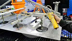 A worker is pressing a steel plan control button to enter the steel cutting process in the industrial
