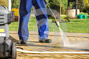 Worker and Pressure Washer