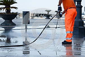 a worker with a pressure washer