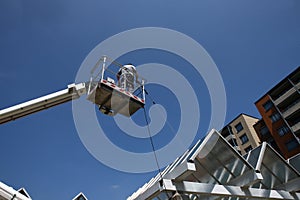 Worker of Professional Facade Cleaning Services washing a glass