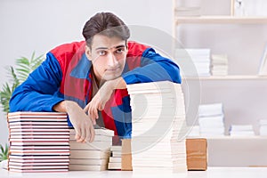 The worker in publishing house preparing book order