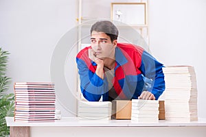 The worker in publishing house preparing book order