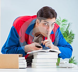 Worker in publishing house preparing book order