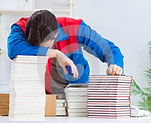 Worker in publishing house preparing book order