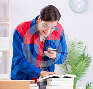 Worker in publishing house preparing book order