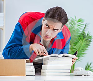 Worker in publishing house preparing book order