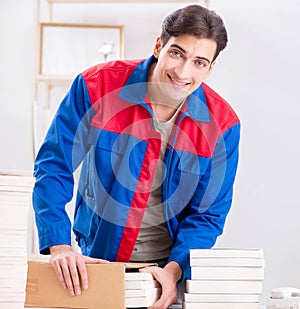 Worker in publishing house preparing book order