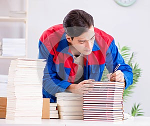 Worker in publishing house preparing book order