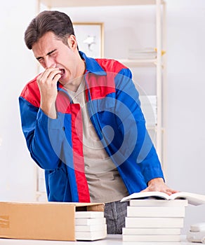 Worker in publishing house preparing book order