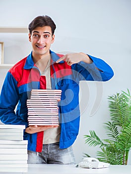 Worker in publishing house preparing book order