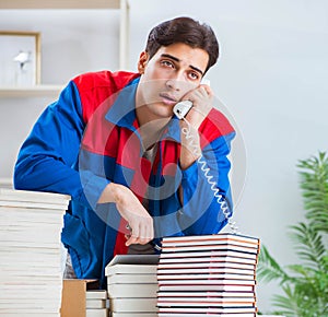 Worker in publishing house preparing book order